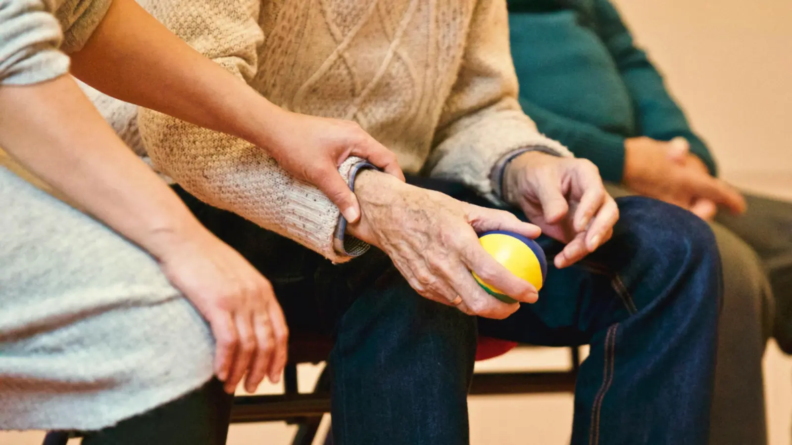 A research nurse comforting a trial participant